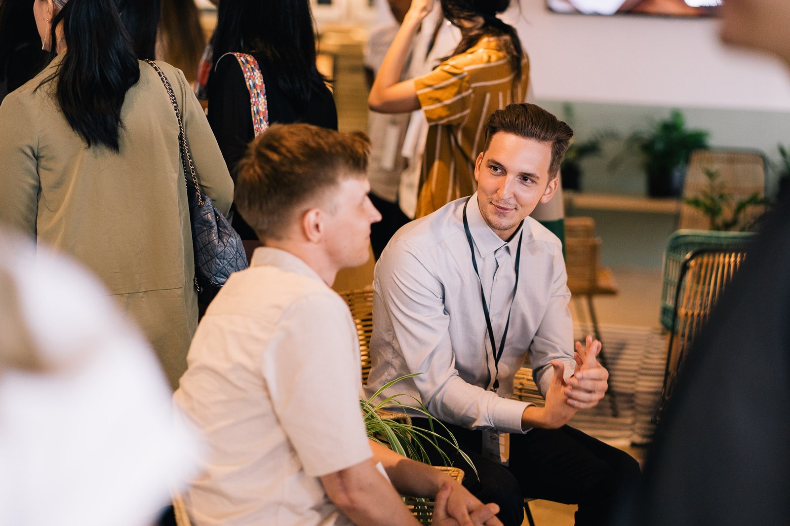 Attendees in conversation before the talks
